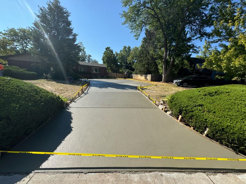 The finished driveway after the pour, taped off while it cures
