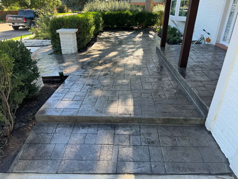 Stamped concrete front porch and steps in a large ashlar pattern